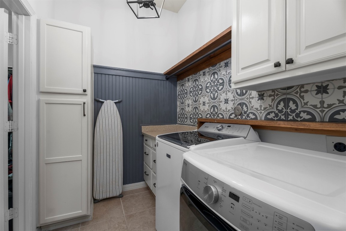 28507 Rose Vervain Drive Spring, TX 77386 - Photo 36 of 50 Super cute and spacious laundry room with convenient access to the primary bedrooms closet.