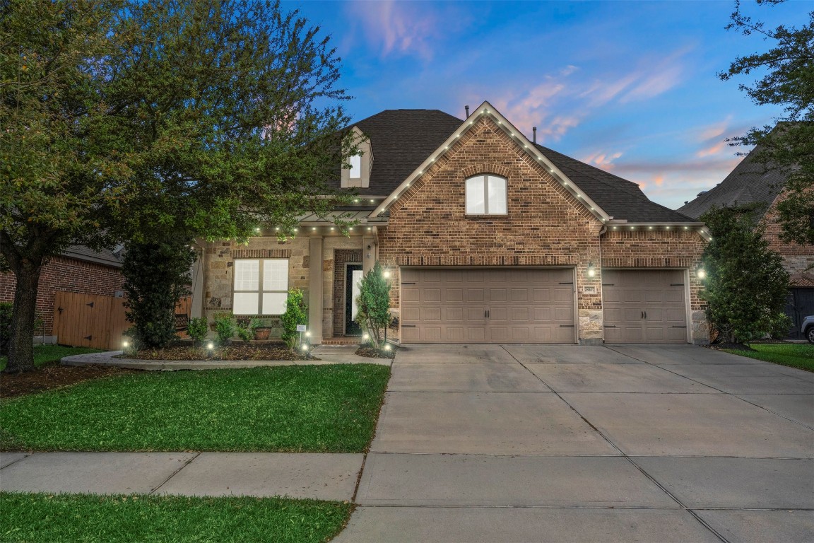 28507 Rose Vervain Drive Spring, TX 77386 - Photo 7 of 50 Beautiful brick and stone elevation with a 3-car garage and year round lights.