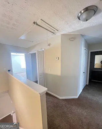 a view of livingroom and hardwood floor