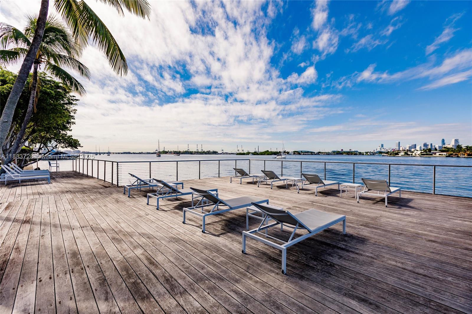 3 Island Avenue, Unit 7A Miami Beach, FL 33139 - Photo 11 of 11 a view of a terrace with wooden benches