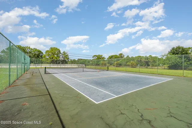 a view of an outdoor space and tennis court