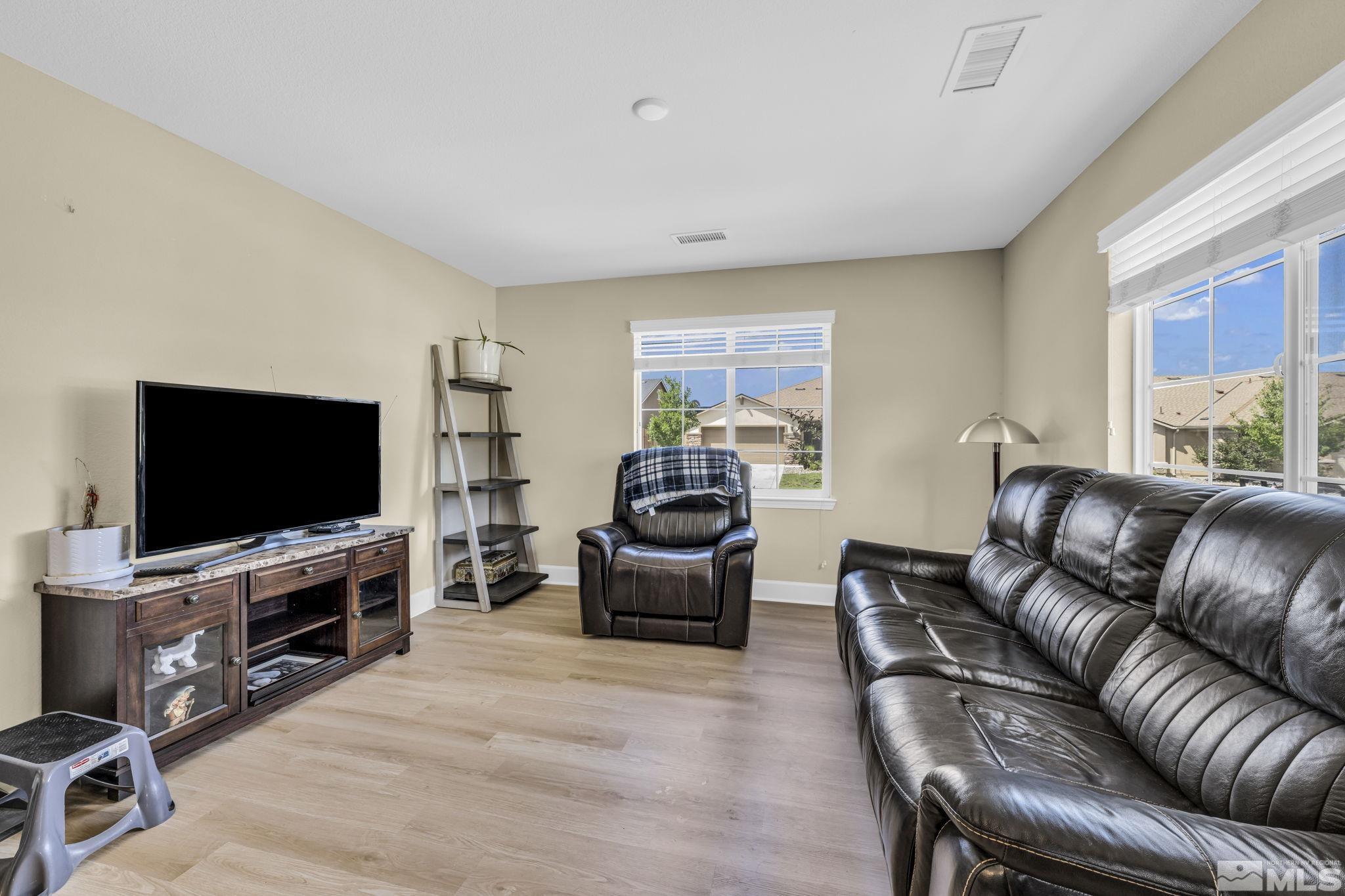 6508 Copper Mountain Drive Carson City, NV 89701 - Photo 17 of 40 a living room with furniture and a flat screen tv