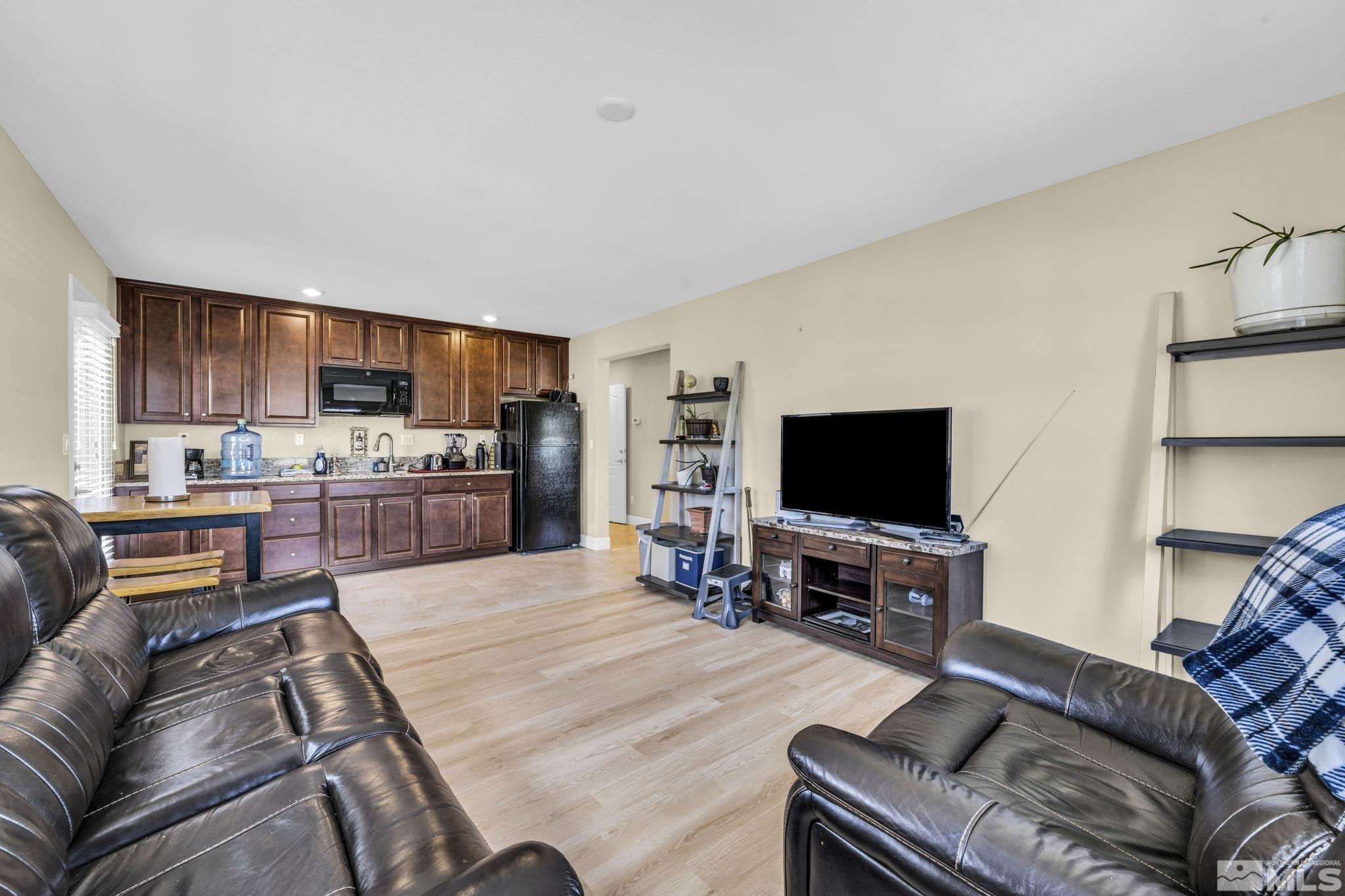 6508 Copper Mountain Drive Carson City, NV 89701 - Photo 18 of 40 a living room with furniture and a flat screen tv
