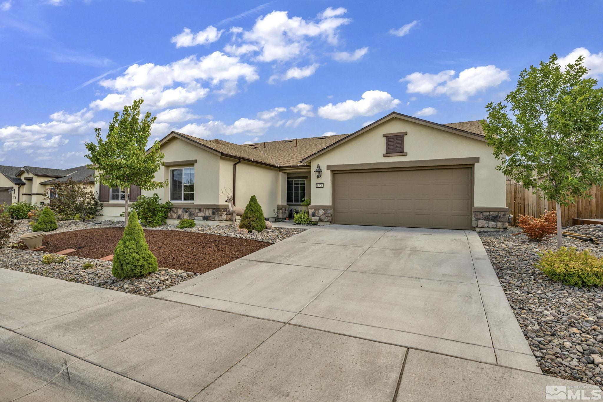 6508 Copper Mountain Drive Carson City, NV 89701 - Photo 25 of 40 a view of a house with a yard and large tree