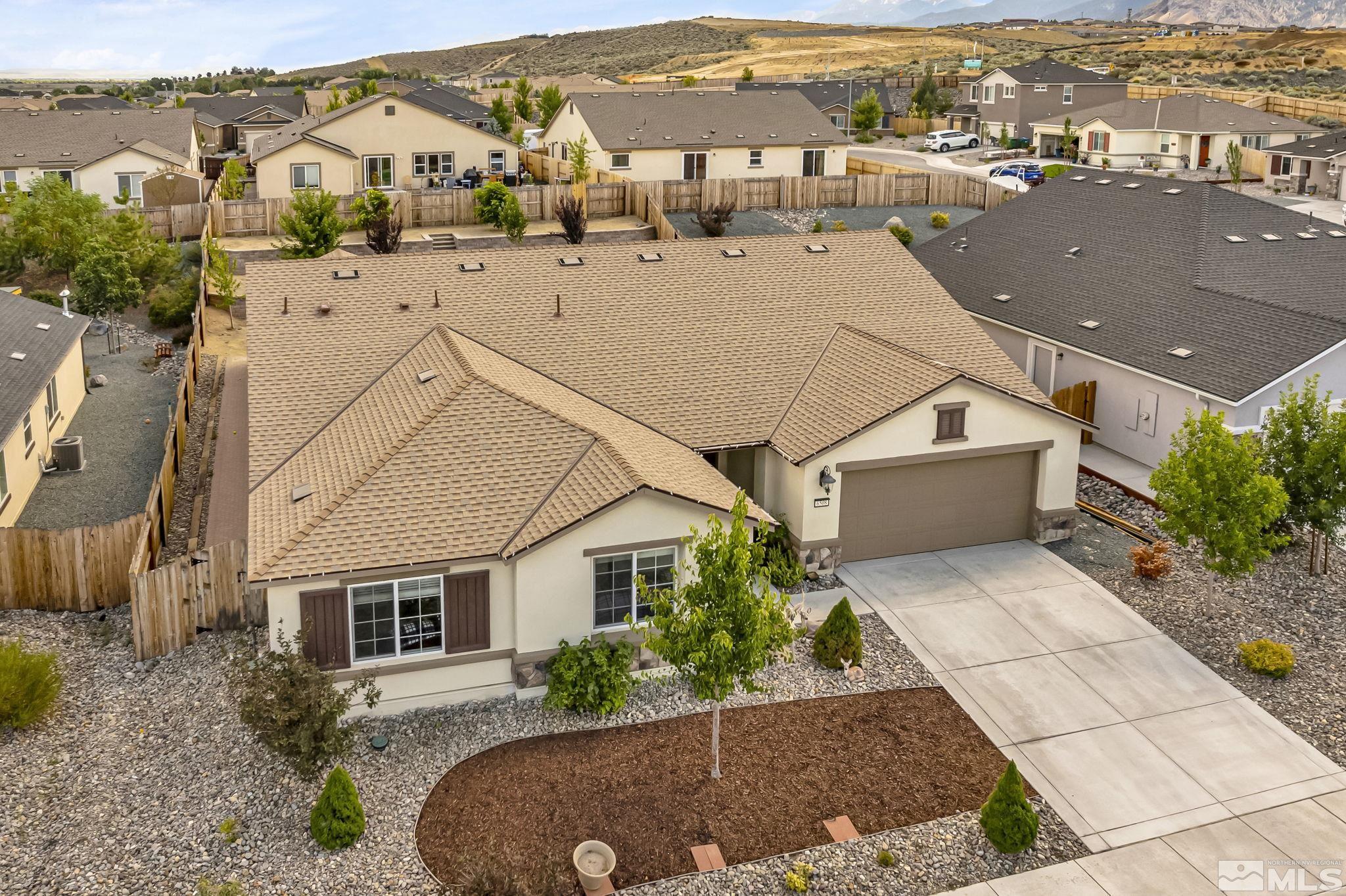 6508 Copper Mountain Drive Carson City, NV 89701 - Photo 26 of 40 an aerial view of a house with a yard and ocean view
