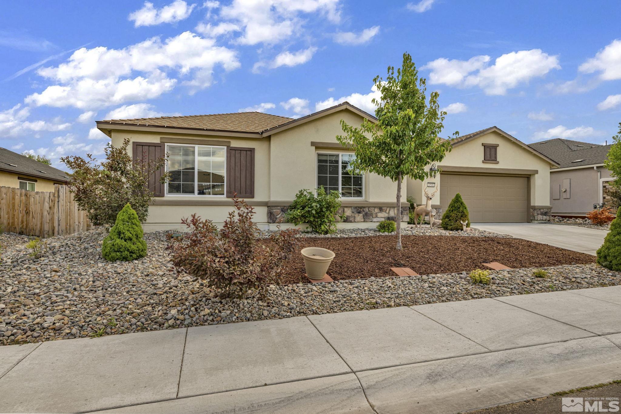 6508 Copper Mountain Drive Carson City, NV 89701 - Photo 27 of 40 a front view of house with yard and green space
