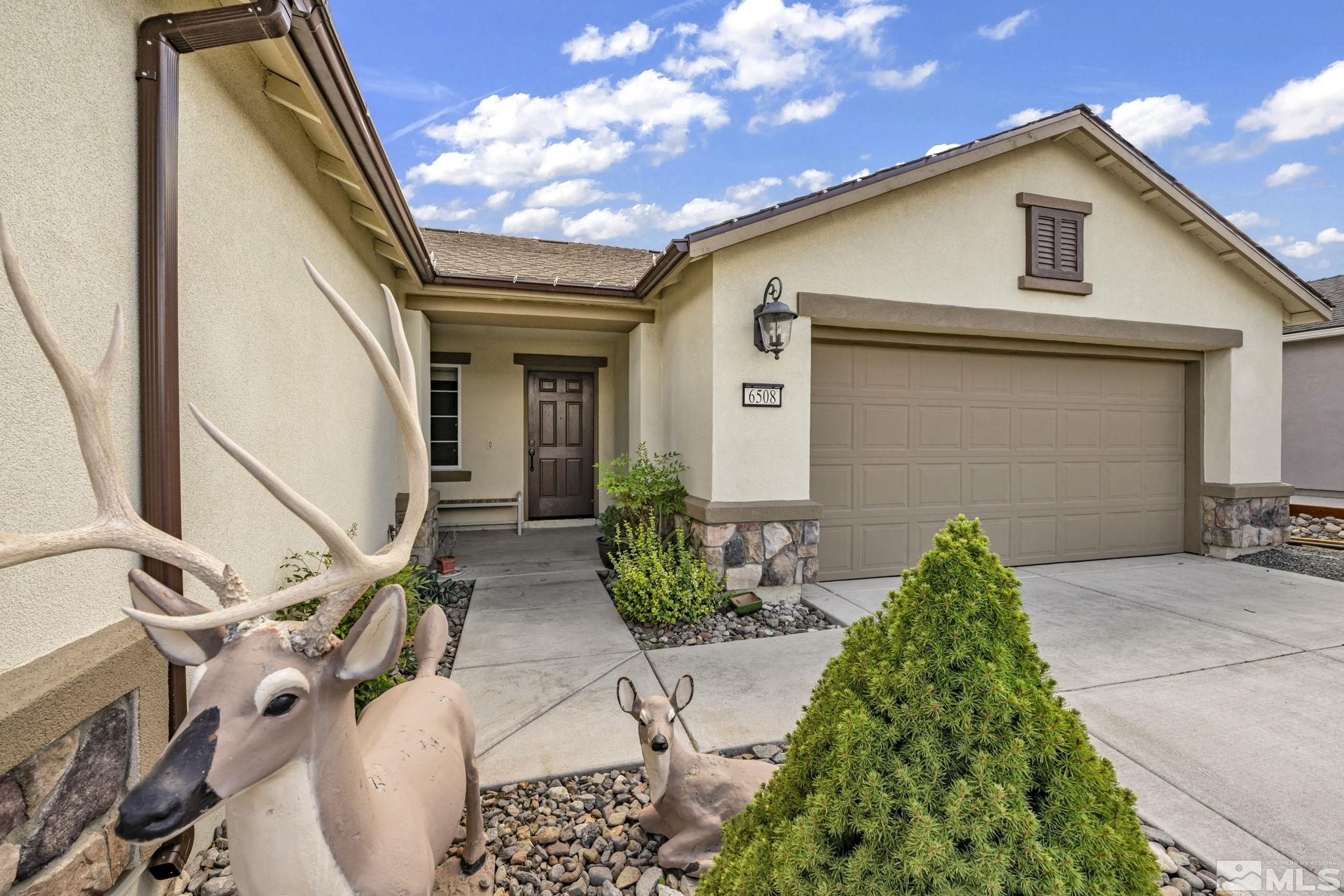 6508 Copper Mountain Drive Carson City, NV 89701 - Photo 29 of 40 a front view of a house with garden