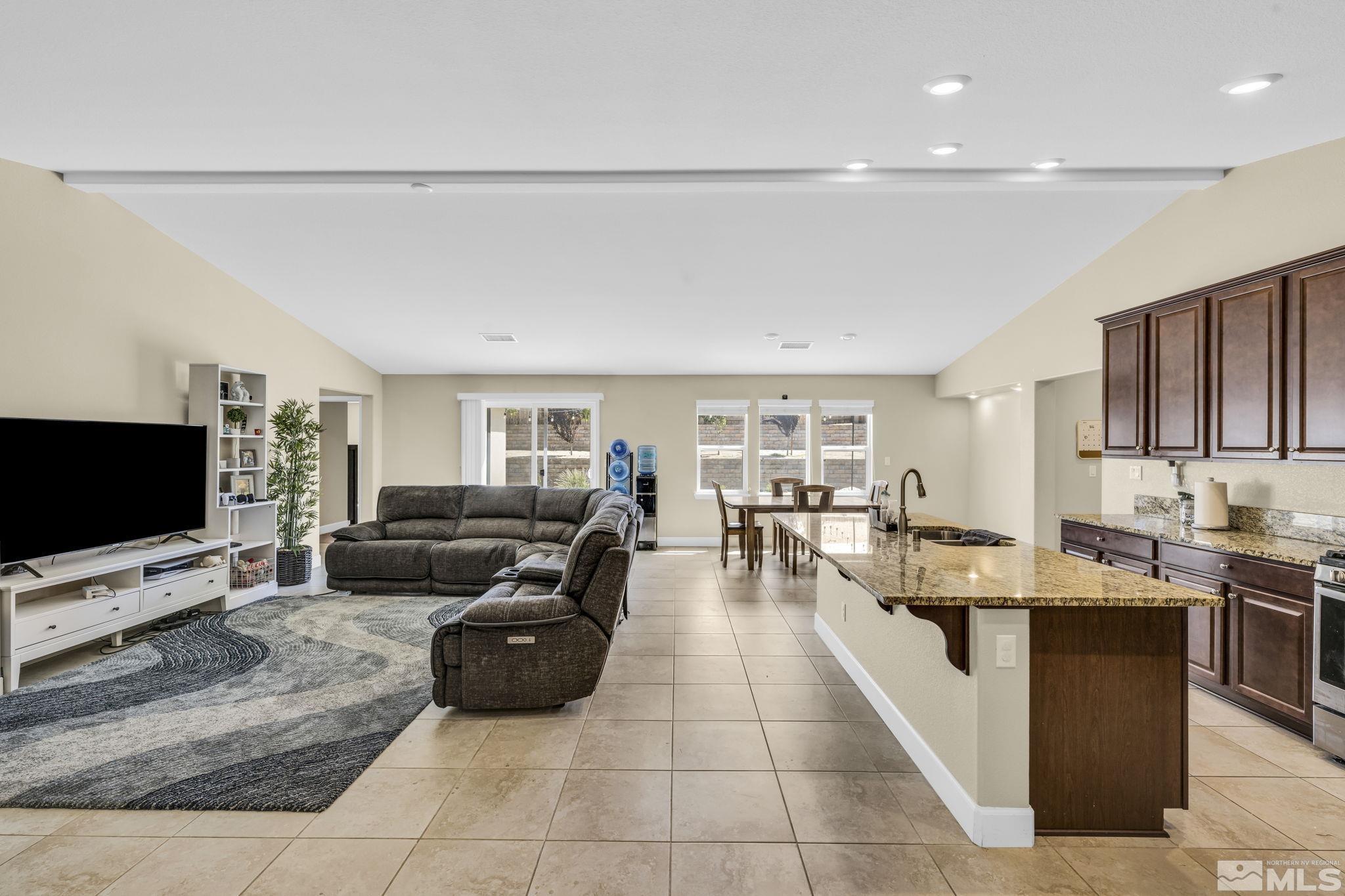 6508 Copper Mountain Drive Carson City, NV 89701 - Photo 3 of 40 a living room with furniture and a flat screen tv