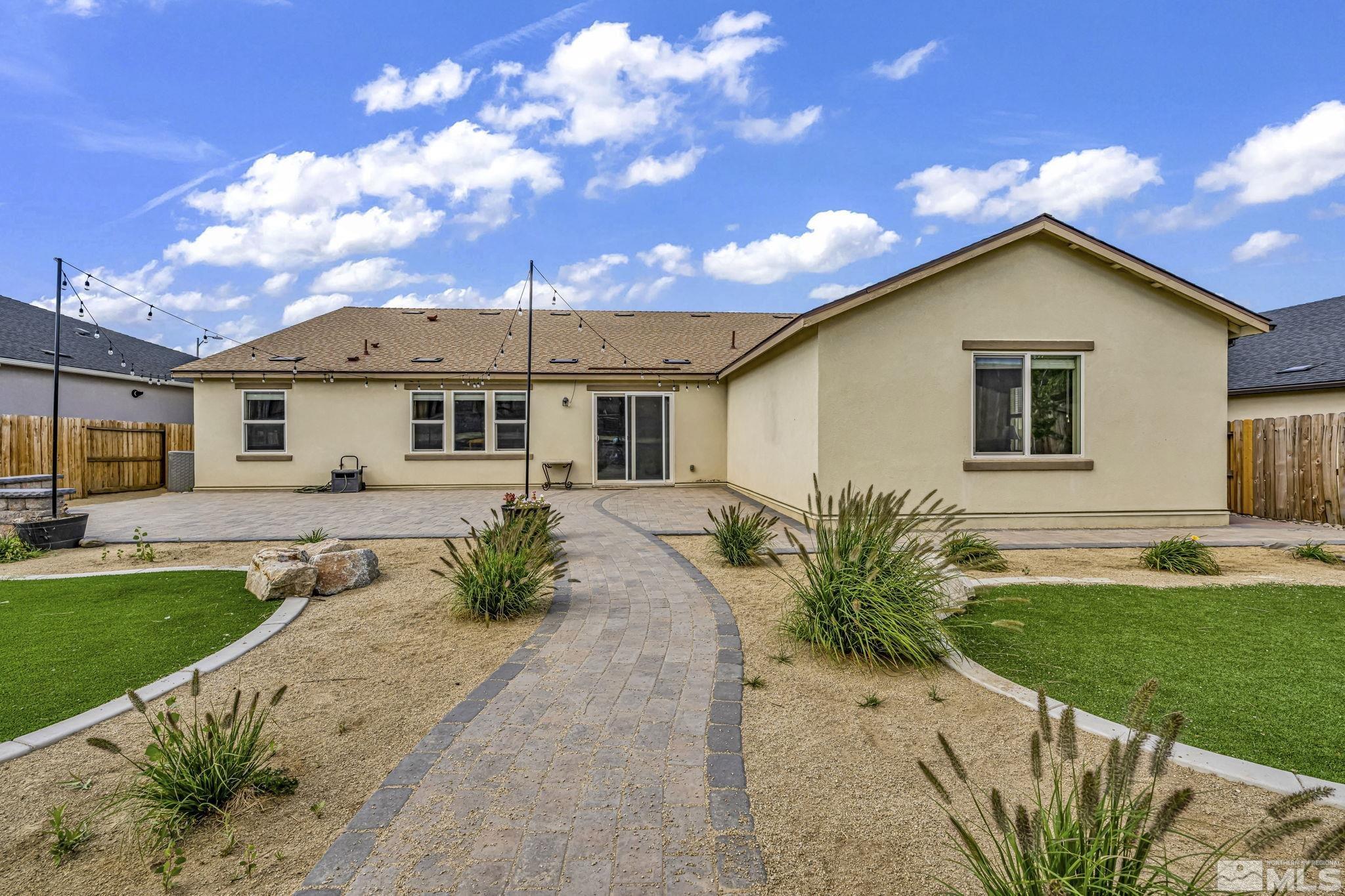 6508 Copper Mountain Drive Carson City, NV 89701 - Photo 40 of 40 a front view of a house with a yard and garage