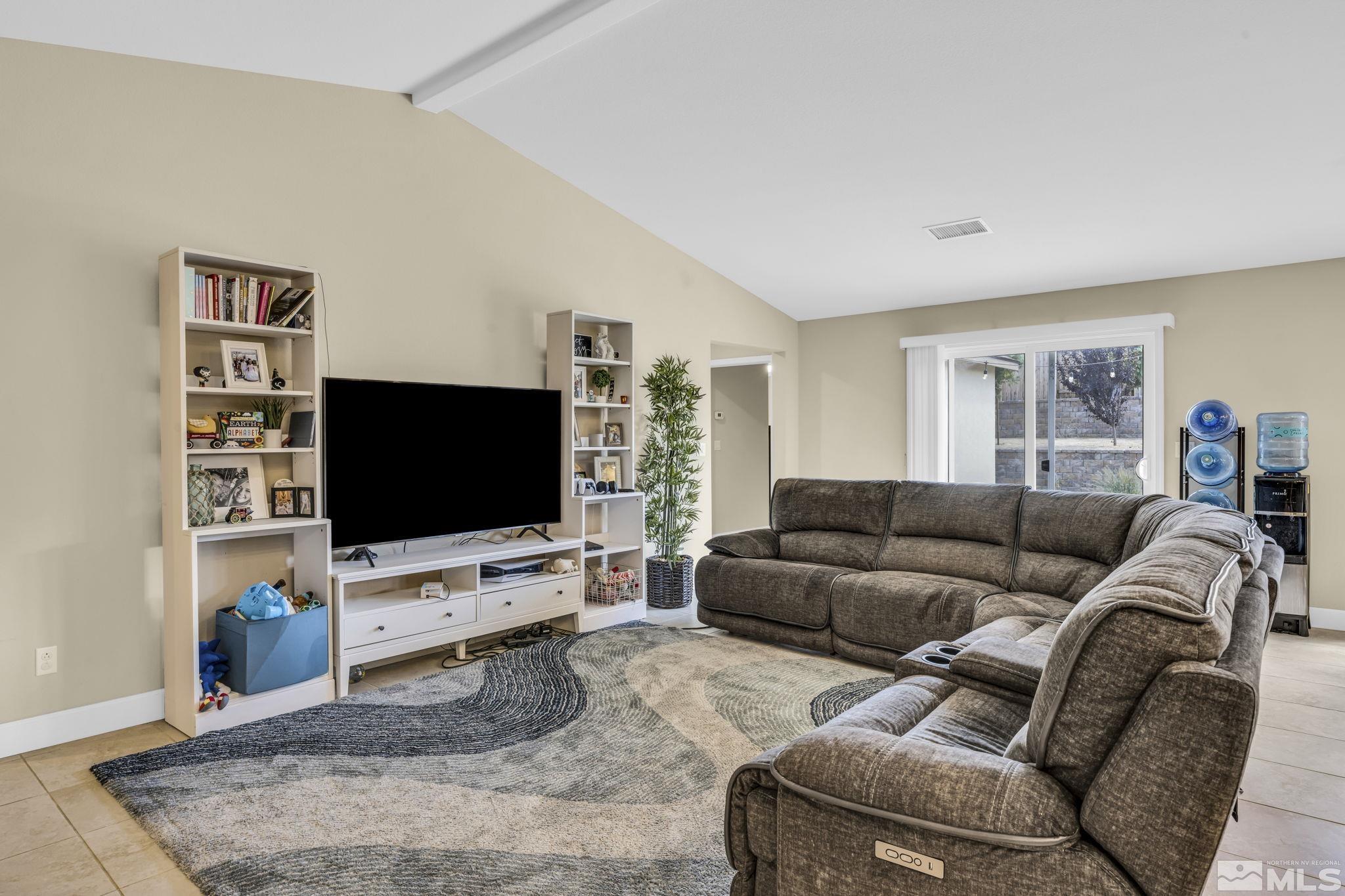 6508 Copper Mountain Drive Carson City, NV 89701 - Photo 6 of 40 a living room with furniture and a flat screen tv
