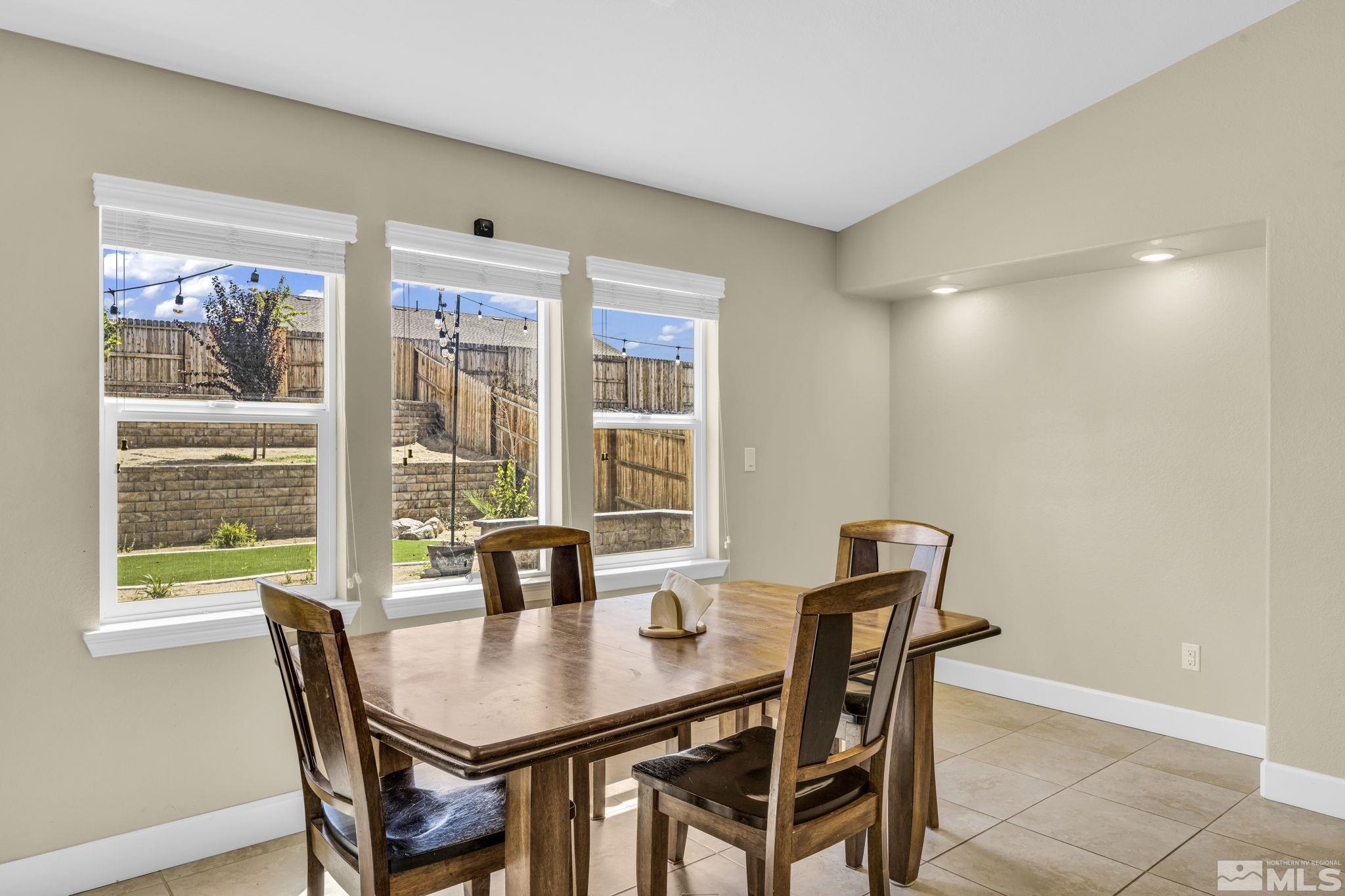6508 Copper Mountain Drive Carson City, NV 89701 - Photo 7 of 40 a view of a dining room with furniture and wooden floor
