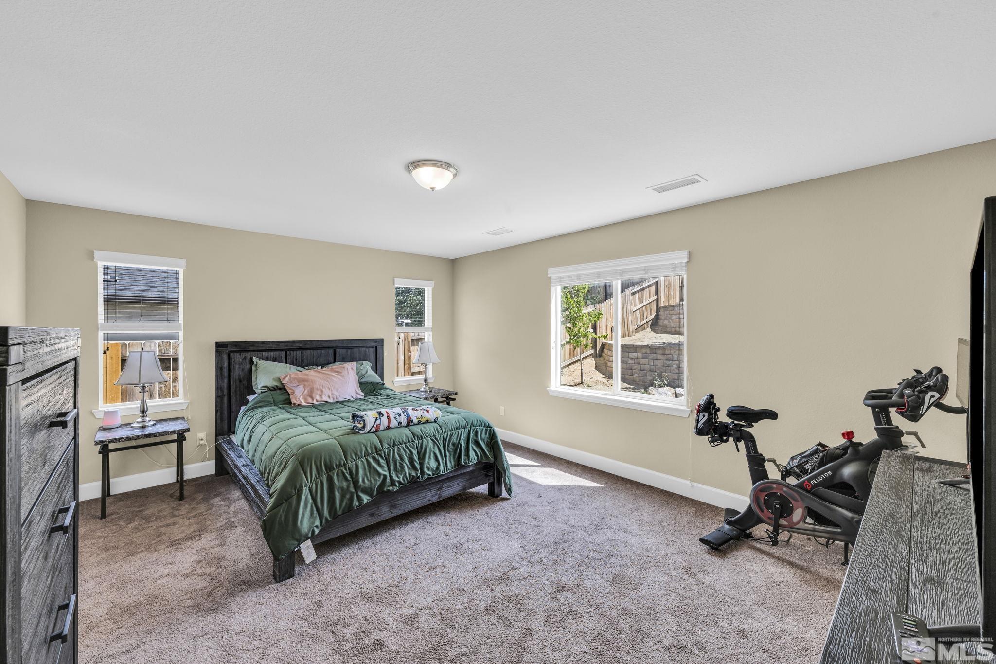 6508 Copper Mountain Drive Carson City, NV 89701 - Photo 9 of 40 a bedroom with a bed and a window