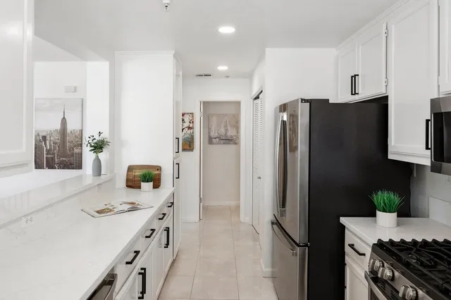 a utility room with dryer washer and a sink