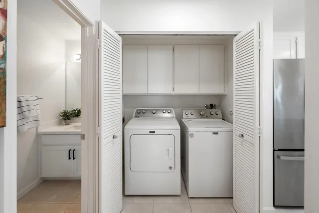 a bathroom with a sink a mirror and shower