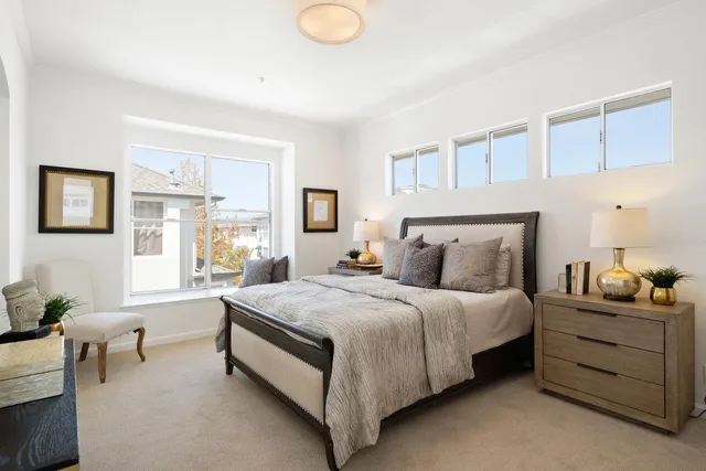 a bed room with a bed and a lamp