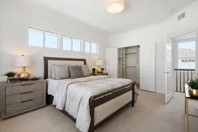 a bedroom with a bed and a couch