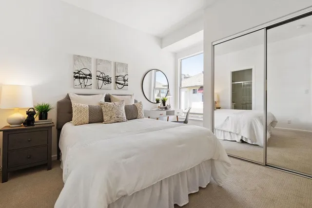 a living room with furniture flowerpot and a window