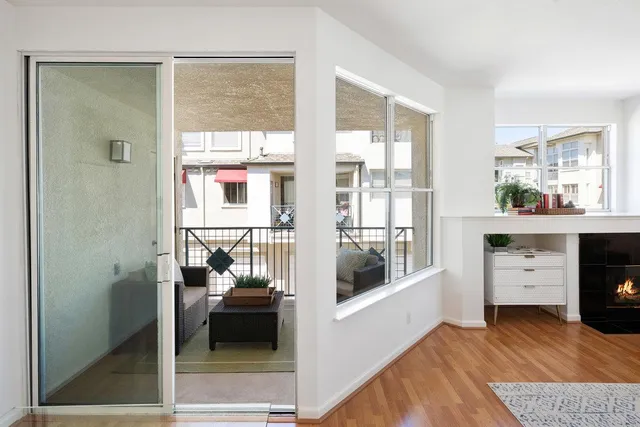 a view of a balcony with furniture