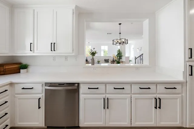 a kitchen with stainless steel appliances a refrigerator sink and stove