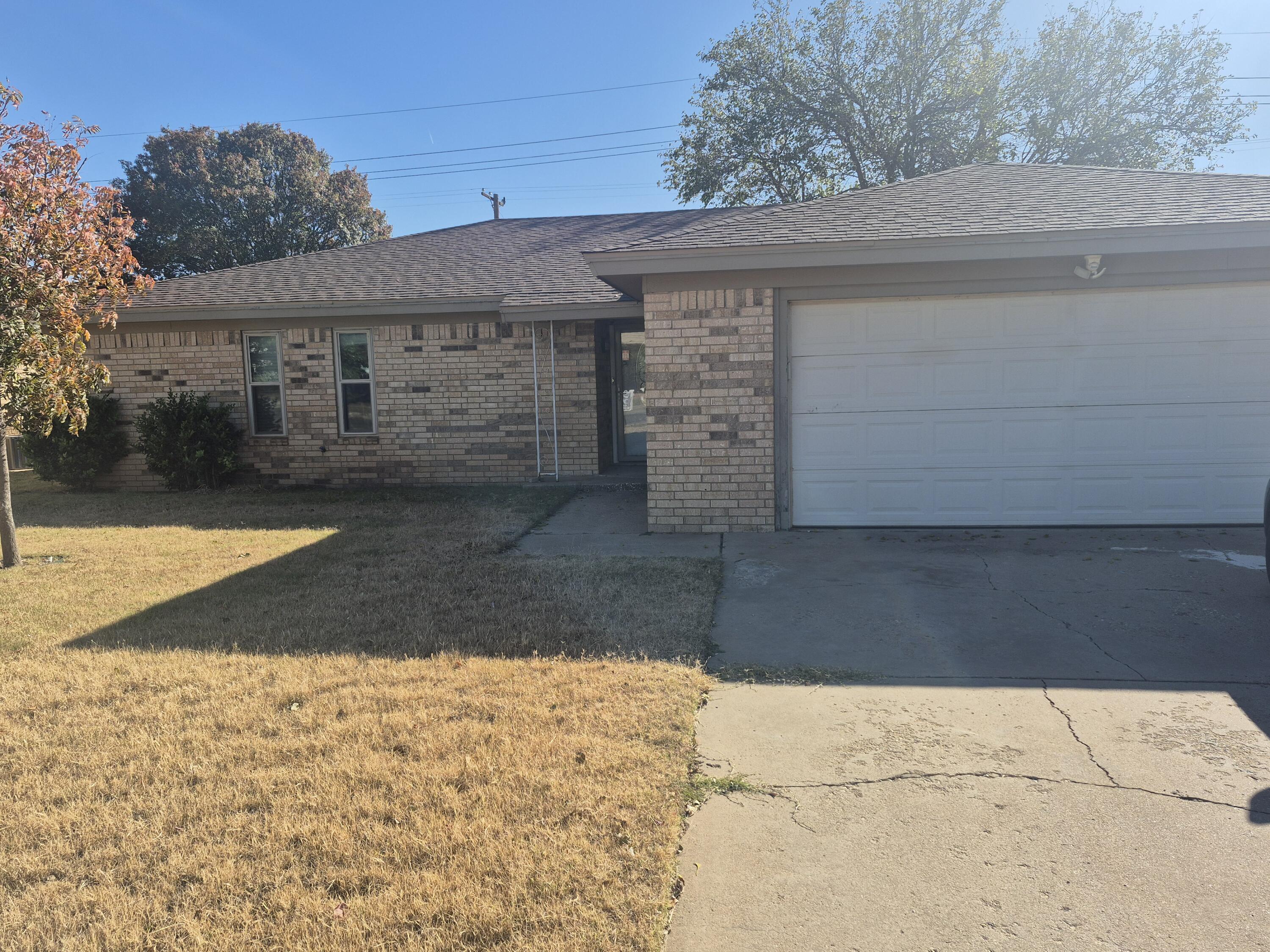 3211 94th Street Lubbock, TX 79423 - Photo 1 of 24 a view of a house with a yard