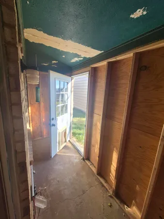 a view of backyard with wooden fence