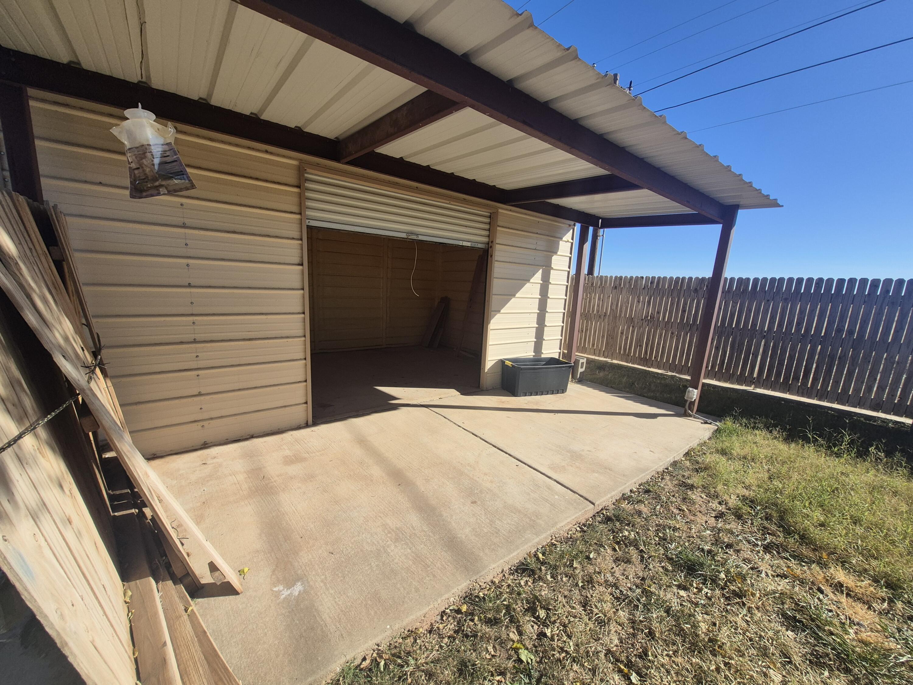 3211 94th Street Lubbock, TX 79423 - Photo 22 of 24 a view of backyard with cabin
