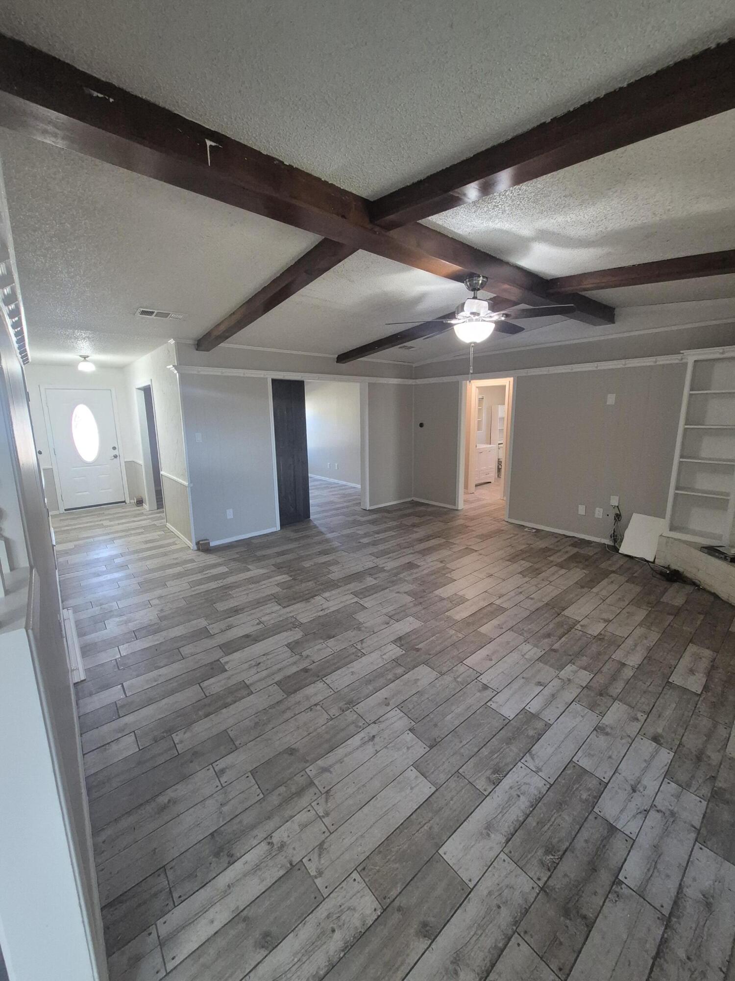 3211 94th Street Lubbock, TX 79423 - Photo 3 of 24 a view of a room with wooden floor