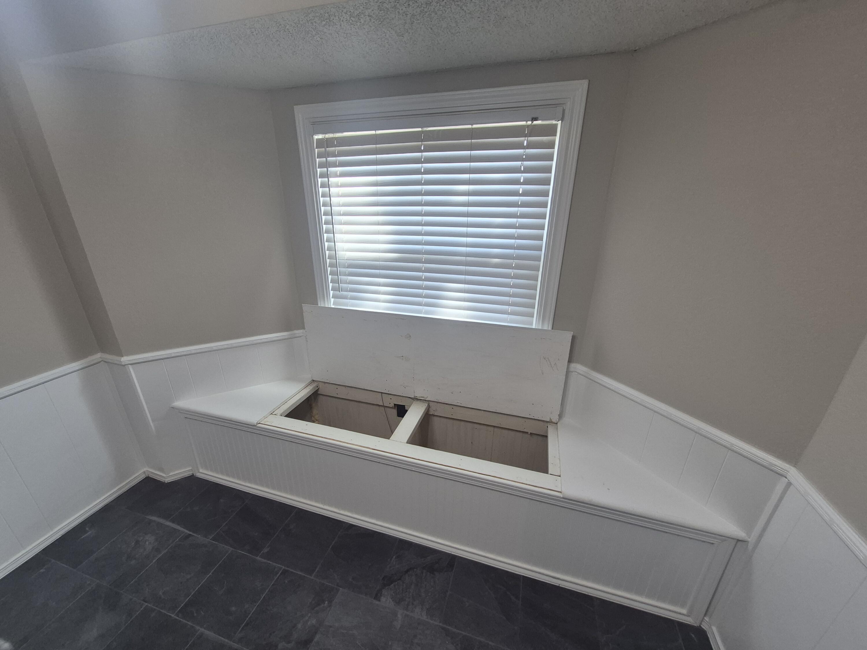 3211 94th Street Lubbock, TX 79423 - Photo 6 of 24 a bathroom with a bathtub and a window
