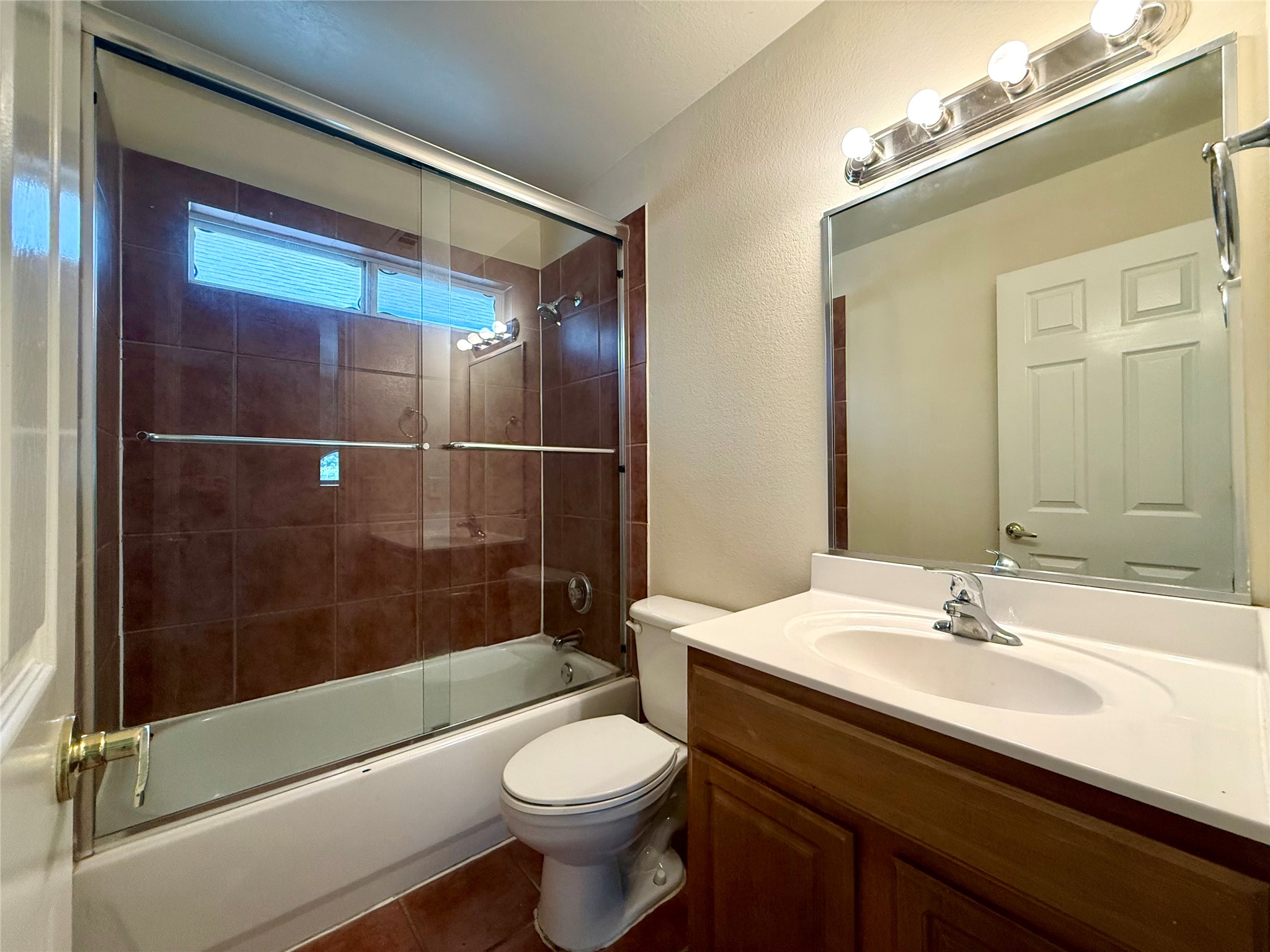 6912 Meador Avenue, Unit A Austin, TX 78752 - Photo 21 of 24 a bathroom with a sink a toilet and shower