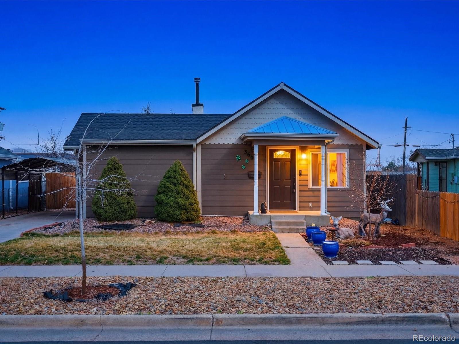 360 South 7th Avenue Brighton, CO 80601 - Photo 1 of 43 a front view of a house with porch