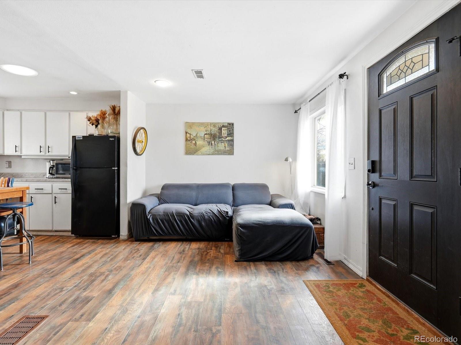 360 South 7th Avenue Brighton, CO 80601 - Photo 11 of 43 a bedroom with furniture and a rug