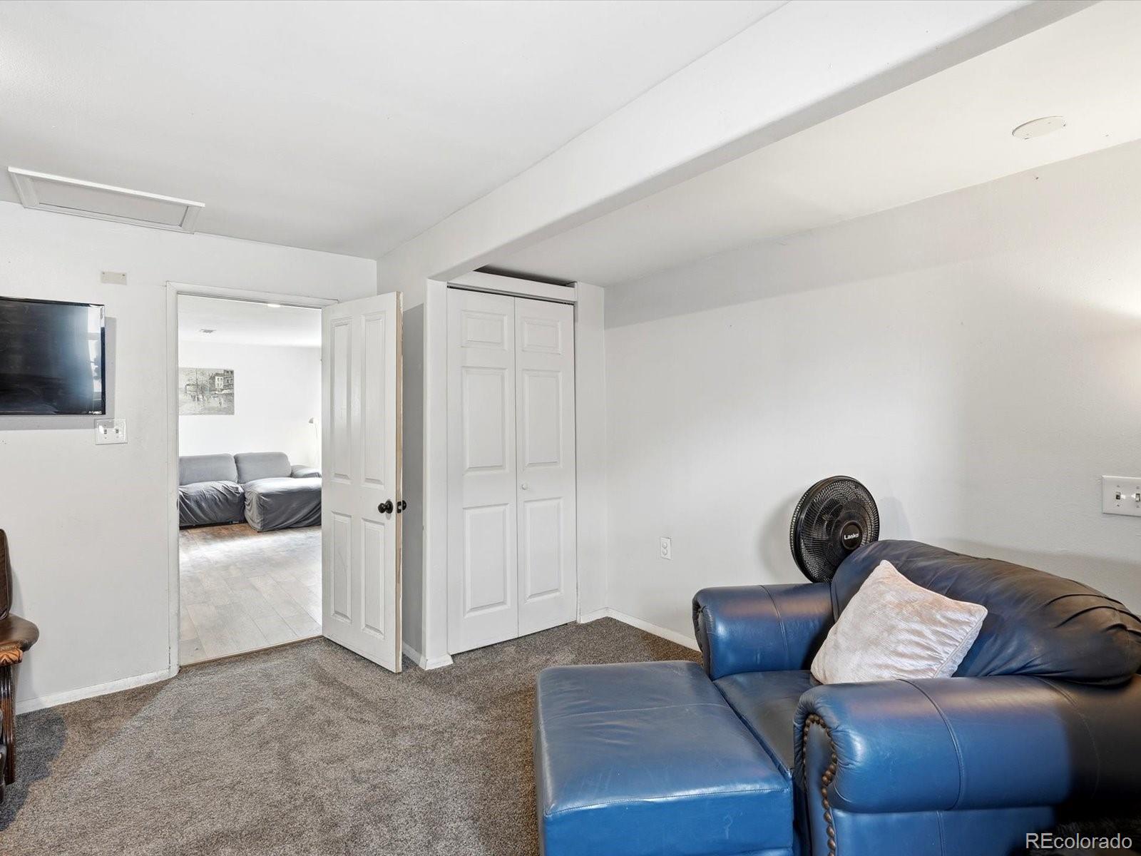 360 South 7th Avenue Brighton, CO 80601 - Photo 23 of 43 a bedroom with furniture and a window