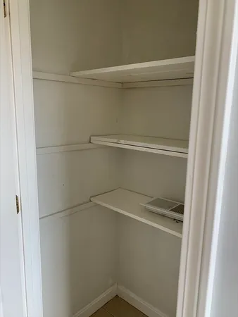 a view of small space with racks on the wall