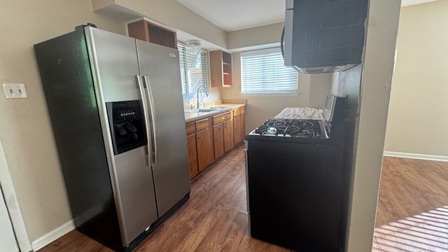 4614 Raintree Boulevard Austin, TX 78745 - Photo 11 of 14 a kitchen with stainless steel appliances granite countertop a refrigerator and a sink