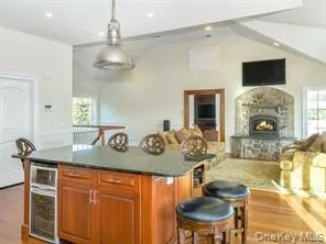a living room with furniture and a dining table