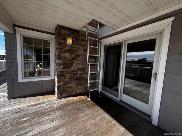 a living room with a flat screen tv and a couch