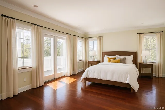 a view of staircase with wooden floor and white walls