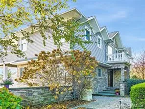 a view of a building with a garden and statue