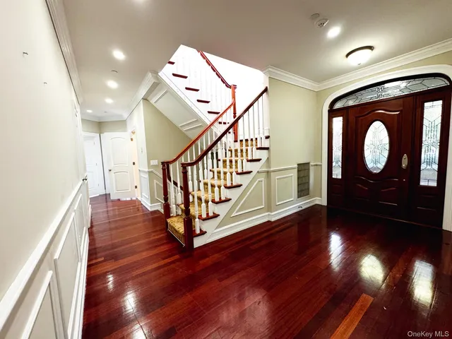 a view of entryway with wooden floor