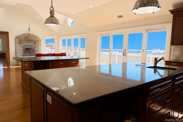 a room with a table chairs and couches