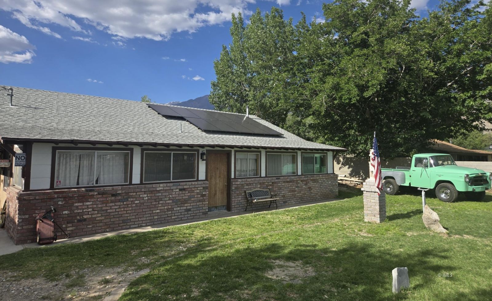 front view of a house with a yard