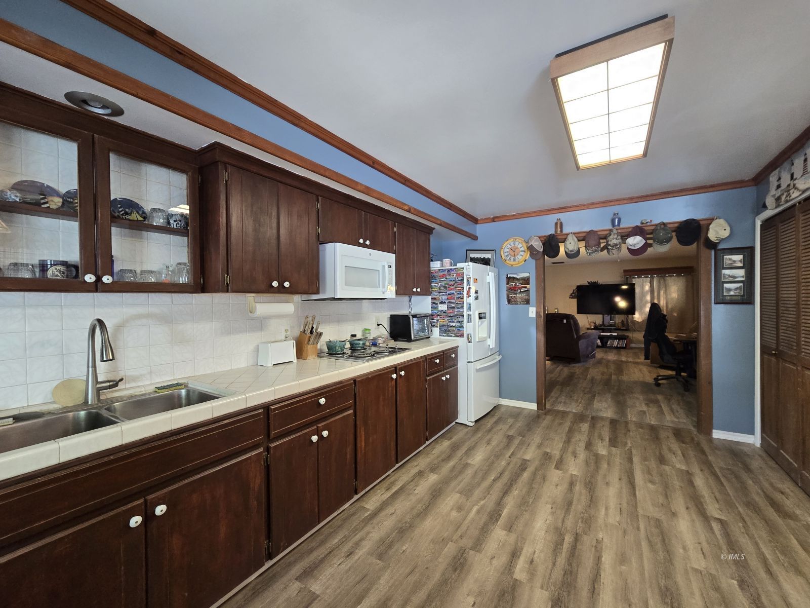 39 Hunter Avenue Bishop, CA 93514 - Photo 9 of 20 a kitchen with granite countertop a sink cabinets stainless steel appliances and a window