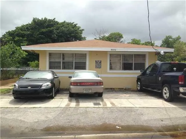 a car parked in front of a house