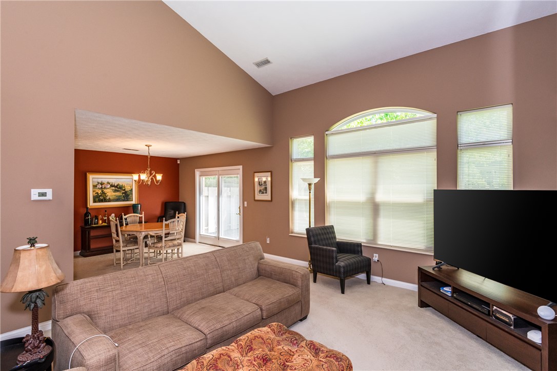 1105 Napa Ridge Dayton, OH 45458 - Photo 9 of 58 Bright and airy living room with vaulted ceilings, ideal for relaxing and entertaining.