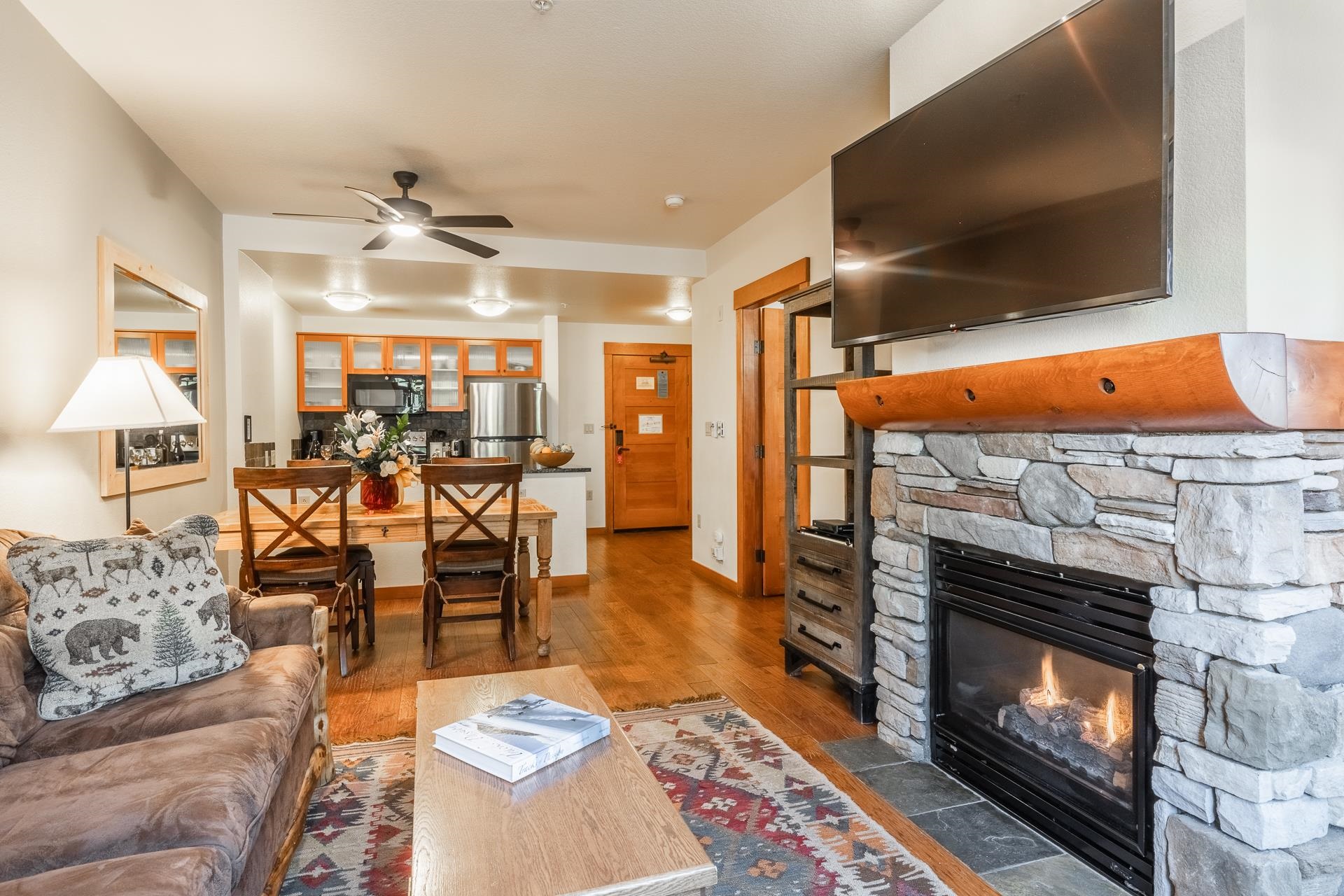 6201 Minaret Road, Unit 2220 Mammoth Lakes, CA 93546 - Photo 5 of 14 a living room with furniture and a fireplace