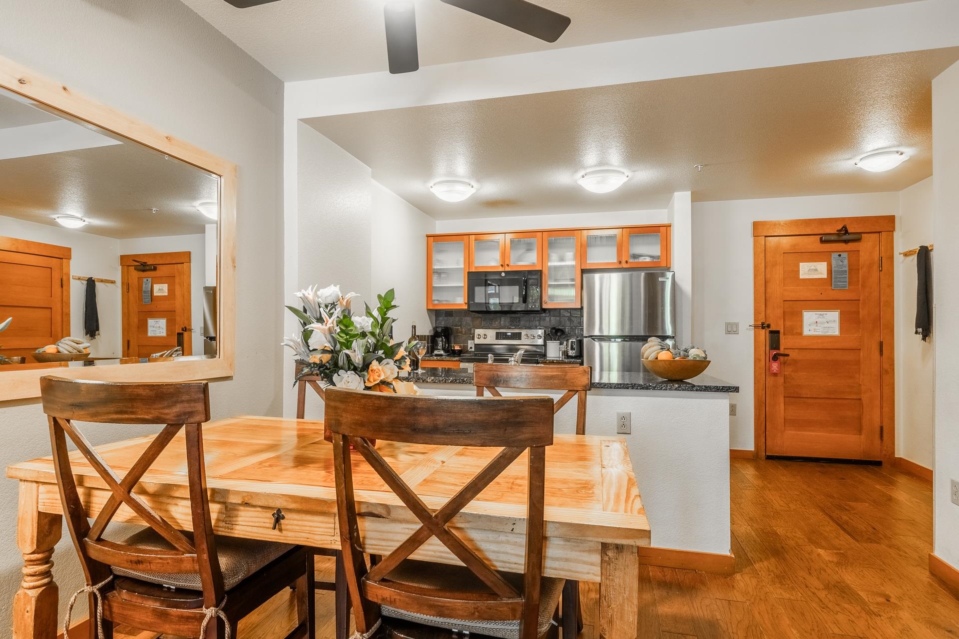 6201 Minaret Road, Unit 2220 Mammoth Lakes, CA 93546 - Photo 6 of 14 a dining room with furniture and wooden floor