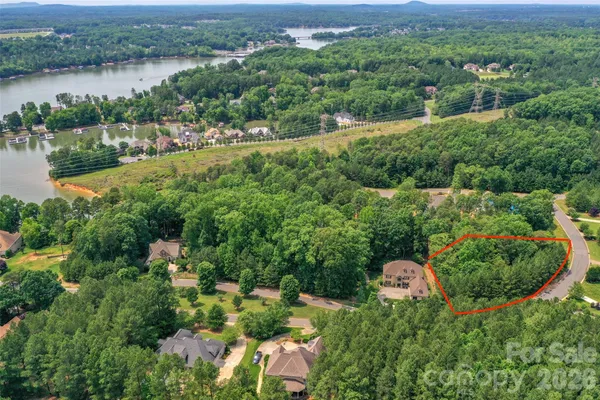 an aerial view of a house with yard and outdoor seating