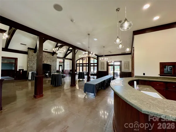 a room with lots of wooden furniture and a window