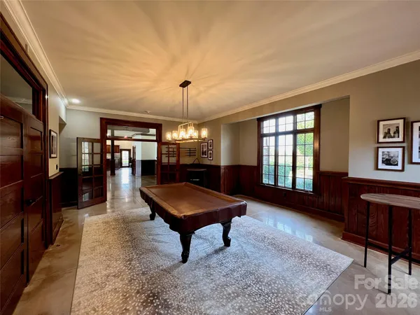 a living room with furniture a table and a fireplace