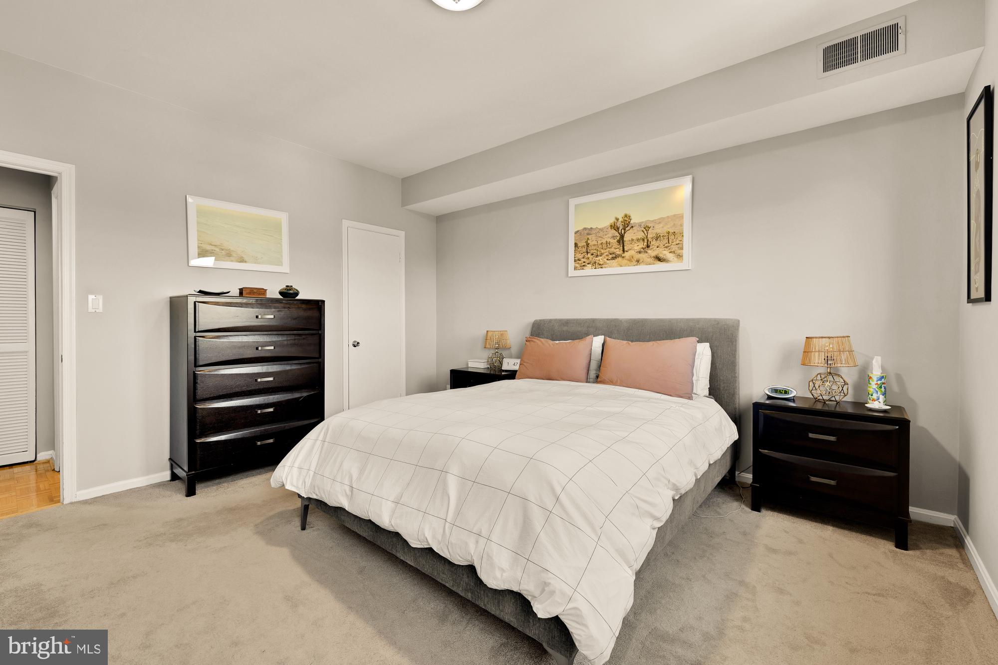 1715 15th Street Northwest, Unit 401 Washington, DC 20009 - Photo 10 of 28 a bedroom with a bed and dresser